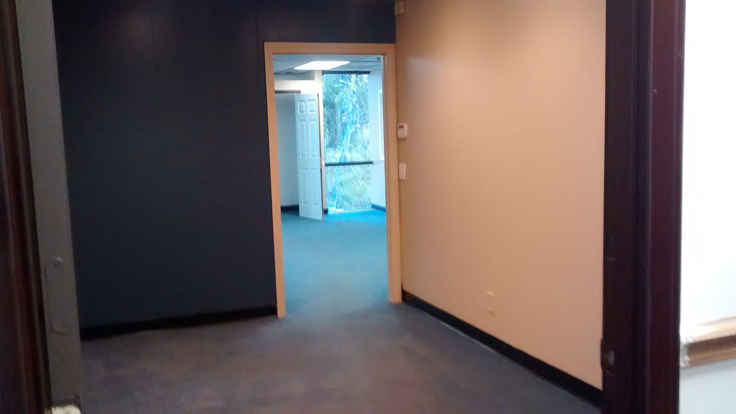 CORNER SUITE, 2 OFFICES, RECEPTION/WORK STATION, OPEN SPACE, STORAGE.